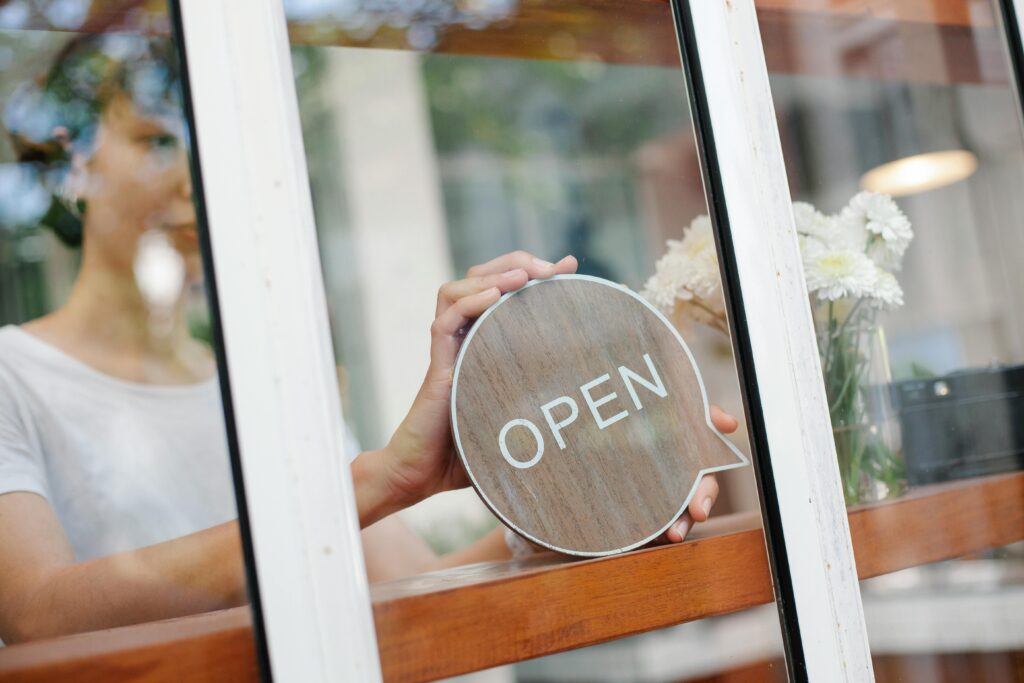 Employee opening restaurant doors representing commercial disputes in a franchise relationship